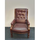 A late 19th century mahogany ox blood leather arm chair.