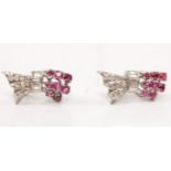A pair of ruby and diamond earrings, the gathered design set with graduated round cut rubies with