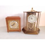 A Mappin and Webb Elliott London mantle clock together with a Kundo brass anniversary mantle clock.