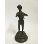 A bronze stature of a boy playing the flute, approx. height 24.5cm