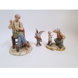 Three Capo Di' Monte figurines, to includea tailor at work with needles, thread and thimble,