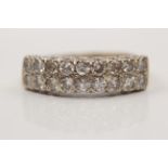 A hallmarked 18ct yellow gold two row diamond ring, set with eighteen round brilliant cut