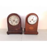 Two mahogany domed-topped mantle clocks.