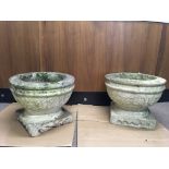 A pair of large, white marble, hand carved garden urns with scroll leaf design on square base,