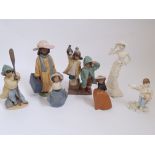 A collection of figurines to include Coalport, Lladro, Nao, and Wedgwood.