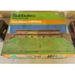 A Subbuteo table soccer stadium edition.