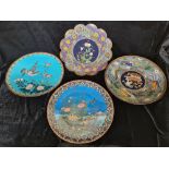 Four blue cloisonné plates with various designs.