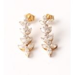 A pair of hallmarked 18ct yellow gold diamond drop earrings, each set with ten marquise cut diamonds