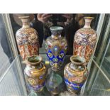 Two pairs of cloisonné vases with one blue vase.