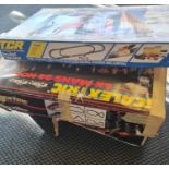 A collection of Scalextric cars and track .