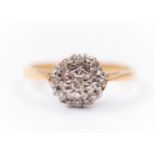 A hallmarked 18ct yellow gold diamond cluster ring, set with round brilliant cut and single cut