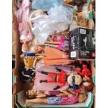 A basket and box of dolls and figures.