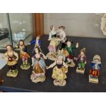 Eight Meissen style figures and one Royal Vienna figure group.