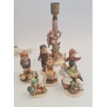 Seven Goebel Hummel figures to include table lamp.