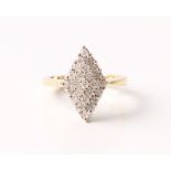 A hallmarked 18ct yellow gold diamond ring, the diamond shaped head set with round brilliant cut