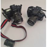 Two Canon cameras EOS 630 and 30 with lenses.