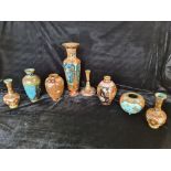 Eight cloisonné vases of various sizes.