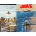 Four advertising movie posters to include Jaws,Superman two,Spider-Man.