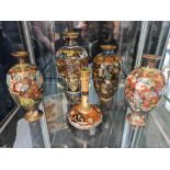 Five cloisonné vases with floral design.