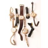 A collection of six hallmarked 9ct yellow gold cased ladies wrist watches, with straps, and one