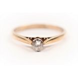 A hallmarked 9ct yellow gold diamond solitaire ring, set with a round brilliant cut diamond