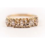A cubic zirconia half eternity ring, set with alternating marquise and round cut CZs, stamped 750,
