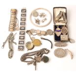 A collection of hallmarked silver, to include medallions, a stamp envelope, a brooch, along with