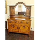 An arts and craft oak mirrored back sideboard.