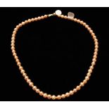 A string of peach cultured pearls, length approx. 20