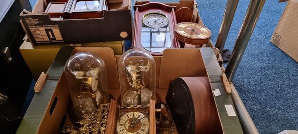 Four boxes containing a quantity of various clocks, to include anniversary, wall clocks etc.
