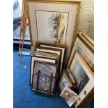 A collection of various framed prints and pictures.