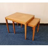 A set of two teak coffee tables