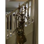 A mid-twentieth century painted Blackamoor, floor standing, six branch candelabra. Approx. height