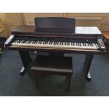 A Technics 'Digital Ensemble' electric piano with stool, model number PR350.