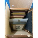 A box containing various prints and pictures.