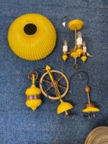 A bright yellow mid-century style light fitting.