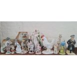 A collection of various china ornaments to include Beswick budgie, Nao figures, chicken, lion etc.