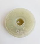 A pale green jade round pierced disk with spiral dragon. Approx 5cm. - Bild 2 aus 2