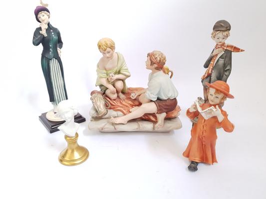 A collection of Capo-D'-Monte figures (A/F one finger damaged from reading child)