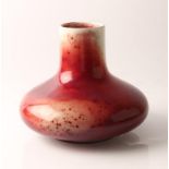 A Ruskin high fired red to cream bulbous vase. 1922 approx height 20cm