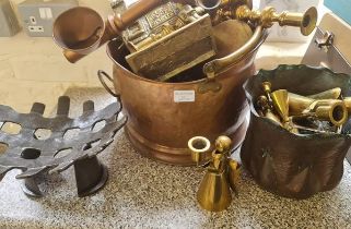 A collection of brass and copper to include candlestick cole bucket and lamp.
