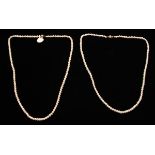 Two strings of cultured pearls, clasps stamped 375, length approx. 20