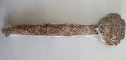 A 20th Century Chinese jade ruyi sceptre with pierced decoration of Chinese characters amongst