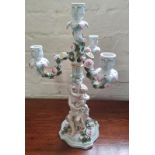 A Meissen cherub candelabra.