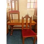 A church Pugin style pine table with two Gothic style chairs.