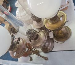 Five oil lamps with shades.