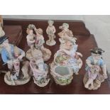 Eight Meissen figurines all with damage.