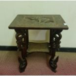 A Anglo-Indian carved table with elephant to top. 62 cm.