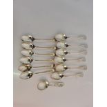 Two sets of hallmarked silver teaspoons and a tea caddy spoon.