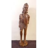 A large one piece carved wood African warrior. Approx 124 cm.